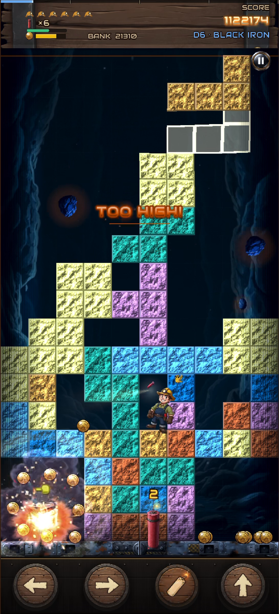 A base blast lets go under a wall of ore.